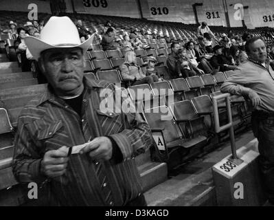 Cowboy watching the National Finals Rodeo in Oklahoma City, Oklahoma, USA Stock Photo