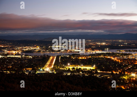 Night-time view of Anzac Parade Lake Burley Griffin and Canberra Australia Stock Photo