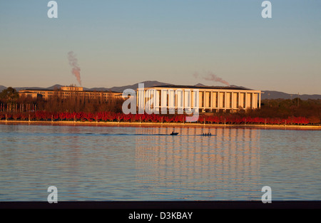 Rowers under training pass The National Library of Australia building Canberra Australia Stock Photo