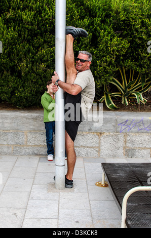 Man doing extreme karate stretching Stock Photo