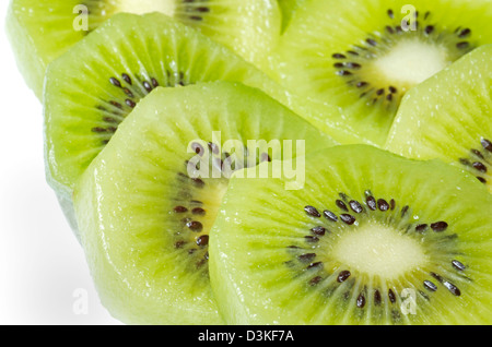 Freshly sliced kiwi on a clear plate,5 slices shown up-close. Stock Photo