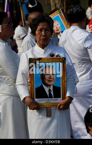 Cambodians Mourn the loss of King Norodom Sihanouk during a procession in his honor. Sisowath Quay Boulevard, Phnom Penh, Cambodia. © Kraig Lieb Stock Photo