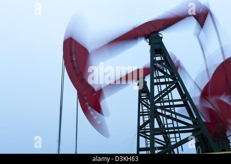 Working oil pump jacks at dusk Stock Photo