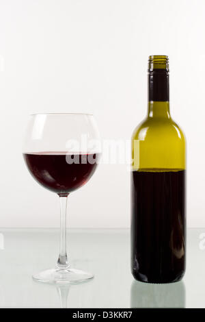 Bottle and glass of red wine on white background Stock Photo