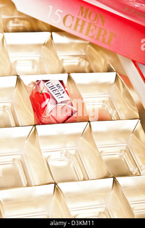 Mon Cheri chocolate box with one bonbons remained Stock Photo