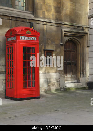 Red telephone box in the City of London by the historic St Mary Aldermary church England UK GB Stock Photo