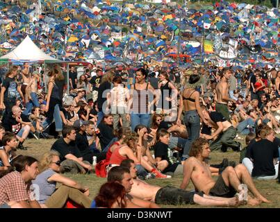 (dpa) - The picture shows visitors of the open air festival 'Przystanek Woodstock' (Woodstock stop) in Kostrzyn, Poland, 05 August 2005. Polands biggest muic festival takes place here on Friday 05 August and Saturday 06 August 2005. According to reports of festival director Jurek Owsiak, 30 rock and folk bands from Poland, Germany, Ucraine and the United States will perform during  Stock Photo