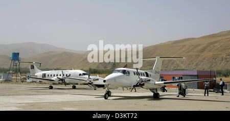 (dpa) - Two civil aircrafts park at the German International Security Assistance Force (ISAF) site in Feisabad, Afghanistan, 29 August 2005. Photo: Michael Hanschke Stock Photo