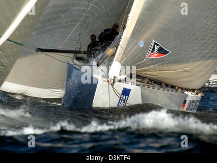 The German sailing yacht 'GER 72' (2L)  of United Internet Team Germany sailes during the 'Act 7' fleetrace of the preliminary regattas in the run-up to the America's Cup yacht race off the coast of Malmoe, Sweden, Saturday, 03 September 2005. Jasper Bank, the Danish skipper of Team Germany and his crew managed to cross the finishing line on seventh place. The German Skipper Jochen Stock Photo