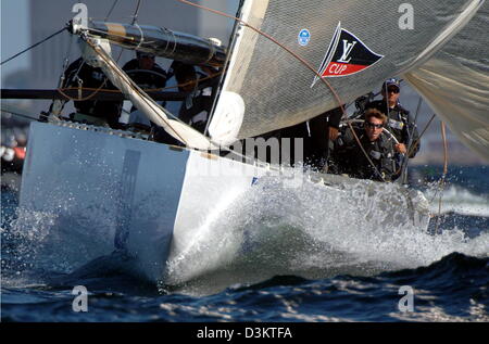 The German sailing yacht Boot GER 72 of the United Internet Teamwith skipper Jesper Bank at the ruder (R) sails  during the second 'Act 7' fleetrace of the preliminary regattas of the America's Cup yacht race off the coast of Malmoe, Sweden, Saturday, 03 September 2005. Jasper Bank, the Danish skipper of Team Germany and his crew managed to cross the finishing line on tenth place.  Stock Photo