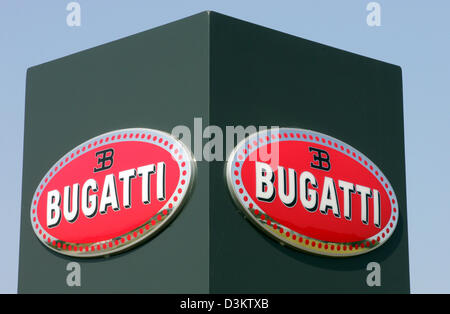 (dpa) - The logo of car manufacturer Bugatti pictured in front of the factory in Molsheim, France, Thursday 8 September 2005. The new model EB Veyron 16.4 is built here. After several delays the Volkswagen daughter Bugatti Automobiles SAS releases the most expensive and fastest car permitted for the road traffic. In the following year a maximum of 300 exemplars of 1001 HP strong an Stock Photo