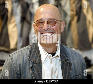 (dpa file) - Heiner Sefranek, CEO of clothing retailer Mustang, smiles as he is pictured in front of shelves with clothing of the denim brand Mustang at the company's headquarter in Kuenzelsau, Germany, 06 April 2005. Photo: Harry Melchert Stock Photo
