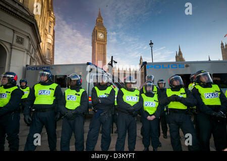 Police line in full riot gear guarding the Houses of Parliament, Day X3 Student Demonstration, London, England Stock Photo