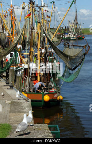 (dpa) - The picture dated 04 August 2005 shows the harbour of the East Frisian city of Greetsiel, Germany. Photo: Heiko Wolfraum