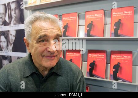 (dpa) - German actor and writer Michael Degen smiles as he stands in front of shelves featuring his new book 'The tax evader' at the international book fair in Frankfurt, Germany, 20 October 2005. Photo: Uwe Zucchi Stock Photo