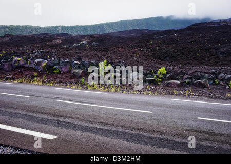 Volcanic road across the lava flow from the eruption of Piton de la Fournaise, Reunion Island, French overseas department Stock Photo