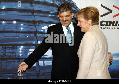 (dpa) - CDU chairwoman and designated German Federal Chancellor Angela Merkel and Turkish Foreign Minister Abdullah Gul enter Merkel's office at the Jacob Kaiser Haus in Berlin, Germany, Friday 18 November 2005. Main issues of the meeting are questions on the Turkish EU membership. Photo: Bernd Settnik Stock Photo