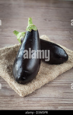 Assortment of fresh eggplant on wooden background Stock Photo
