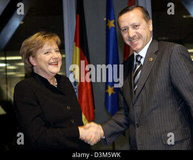 (dpa) - German Chancellor Angela Merkel meets for talks with Turkish Prime Minister Recep Tayyip Erdogan in Barcelona, Spain, 27 November 2005. Merkel is in Barcelona for the Euro-Mediterranean summit. Photo: Peer Grimm Stock Photo