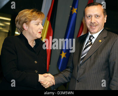 (dpa) - German Chancellor Angela Merkel meets for talks with Turkish Prime Minister Recep Tayyip Erdogan in Barcelona, Spain, 27 November 2005. Merkel is in Barcelona for the Euro-Mediterranean summit. Photo: Peer Grimm Stock Photo