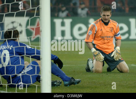 (dpa) - FC Schalke 04 goalkeeper Frank Rost (R) and defender Mladen Krstajic sit frustrated on the pitch during the UEFA Champions League first round final match against AC Milan at the Guiseppe Meazza stadium in Milan, Italy, Tuesday 06 December 2005. Photo: Achim Scheidemann Stock Photo