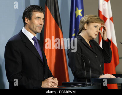 (dpa) - German Chancellor Angela Merkel welcomes the Danish Minister President Anders Fogh Rasmussen in Berlin, Germany, Wednesday 07 December 2005. Righ after Merkel and Rasmussen started bilateral talks at the German Chancellery. Photo Peer Grimm Stock Photo