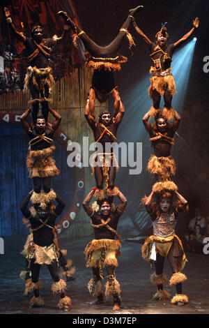 (dpa) - Nine people build a human pyramid during the premiere show of artistic director Andre Heller's 'Africa! Africa!' at the Old Opera House in Frankfurt Main, Germany, Wednesday evening 14 December 2005. Photo: Christine Kokot Stock Photo