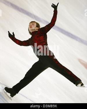 (dpa) - German figure skater Stefan Lindemann (25) perform in the men's free skating competition at the German Championships in Figure Skating in Berlin, Friday, 30 December 2005. Lindemann took his fifth title, but is still required to improve for the European championships in Lyon end of January. Photo: Michael Hanschke Stock Photo