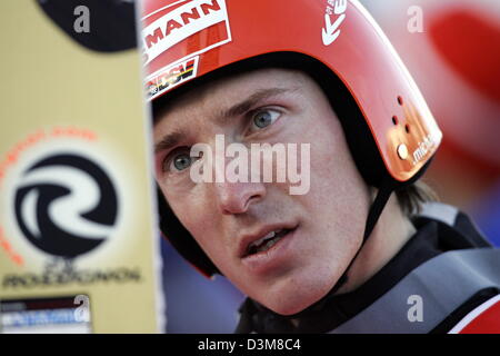 (dpa) - German ski jumper Michael Uhrmann looks at his ski during the practice for the 2nd jump of the 54th Four Hills Tournament in Garmisch-Partenkirchen, Germany, 31 December 2005. Uhrmann was able to qualify for the New Year's jump. Photo: Matthias Schrader Stock Photo