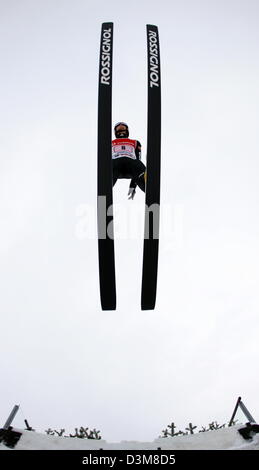 (dpa) - German ski jumper Michael Uhrmann pictured airborne during his jump at the New Year's Jump event of the 54th FIS Four Hills Tournament in Garmisch-Partenkirchen, Germany, 1 January 2006. The starters are on very equal level in this year's traditional competition, at least ten of them have potential for the victory. The German team is going to improve its performance in the  Stock Photo