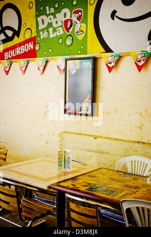 Inside a cafe next to Hotel Tsilaosa off main high street in Cilaos, French island Reunion, Indian Ocean - Bourbon is local beer Stock Photo
