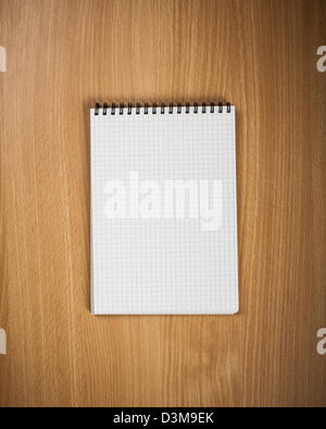 Notebook with pen on wood background - Back to school concept Stock Photo