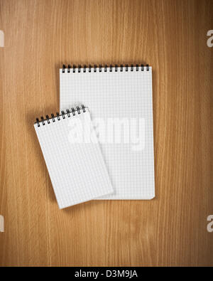 Notebook with pen on wood background - Back to school concept Stock Photo