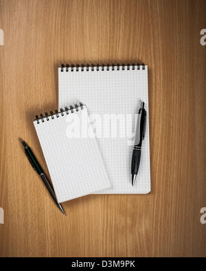 Notebook with pen on wood background - Back to school concept Stock Photo