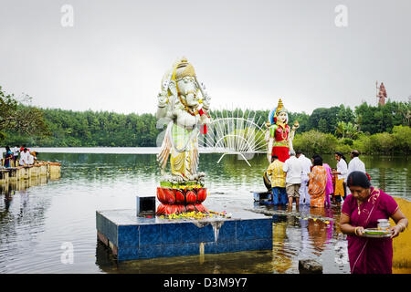 Hindus make offerings to Hindu Gods at Grand Bassin at Ganga Talao lake, Mauritius - considered holiest place in Mauritius Stock Photo