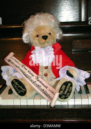 (dpa) - The undated handout picture shows an teddy bear by the toy manufacturer Hermann with a white wig and corresponding clothes sitting on the keys of a piano, Germany. On time for the 250 anniversary of Wolfgang Amadeus Mozart's birthday on 27th January the toy manufacturer present a 'Special Birthday Edition'. Photo:Hermann-Coburg Stock Photo