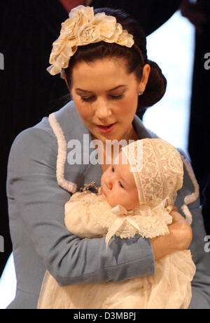 Danish Crown Princess Mary holds her baby son in her arms after the baptism ceremony at the chapel of Castle Christianborg on Copenhagen, Denmark, Saturday, 21 January 2006. Princess Mary's and Prince Frederik's  three-months old baby was baptised Prince Christian and is following his father Crown Prince Frederik as second in line to succeed to the Danish throne. Members of numerou Stock Photo