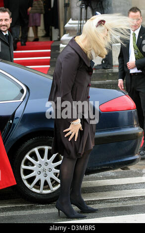 Norway's Crown Princess Mette-Marit, with fluttering hair tossed around by the wind, holds on to her skirt as she arrives for the baptism ceremony of the baby of Danish Crown Princess Mary and Crown Prince Frederik at the chapel of Castle Christianborg on Copenhagen, Denmark, Saturday, 21 January 2006. Princess Mary's and Prince Frederik's three-months old baby was baptised Prince  Stock Photo