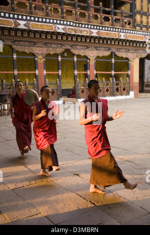 Young monks at Paro Dzong rehearse dance routines, Bhutan, Asia Stock Photo