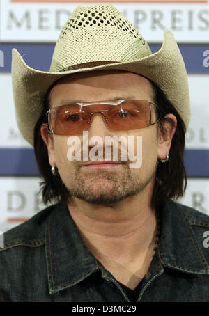 ATTENTION EMBARGO 24 January 2006, 19UHR/ 7PM -- Bono, frontman of Irish rock band 'U2' takes part in a press conference at the convention centre in Baden-Baden, Germany, Tuesday, 24 January 2006. Bono (45) will receive the German Media Prize on Tuesday evening 24 January. He is being awarded for his humanitarian committment in particular to the problems in Africa. The awarded, whi Stock Photo