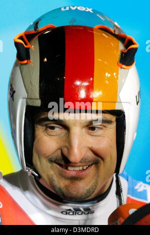 German triple gold medal winner Georg Hackl smiles in an interview after his second run at the Olympic luge track in Cesana Pariol, Italy, Saturday 11 February 2006. Taking fifth place after two of four runs his sixth Olympic medal lies still within reach. Italian gold favourite Armin Zoeggler clocked fastest time. Photo: Arne Dedert Stock Photo