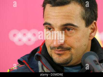German luger Georg Hackl listens to questions from journalists during a press conference at the Olympic luge track in Cesana Pariol, Italy, Sunday 12 February 2006.The triple Olympic gold medal winner ended his career 7th placed in the Olympic luge competition Photo: Arne Dedert Stock Photo