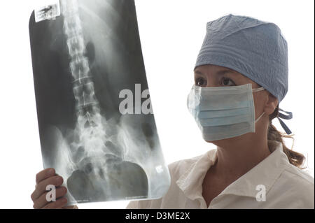 woman doctor looking at spinal X-ray Stock Photo