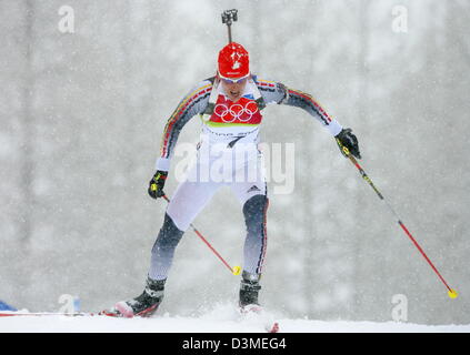 (dpa) - German biathlete Kati Wilhelm photographed while it snows during the women's 10km pursuit race at the Olympic biathlon track in San Sicario, Italy, Saturday 18 February 2006. Wilhelm won the gold medal. Photo: Arne Dedert Stock Photo