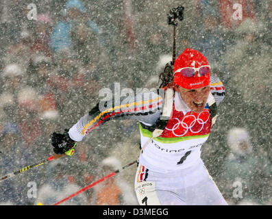 (dpa) - German biathlete Kati Wilhelm photographed while it snows during the women's 10km pursuit race at the Olympic track in San Sicario, Italy, Saturday 18 February 2006. Wilhelm won gold. Photo: Martin Schutt Stock Photo