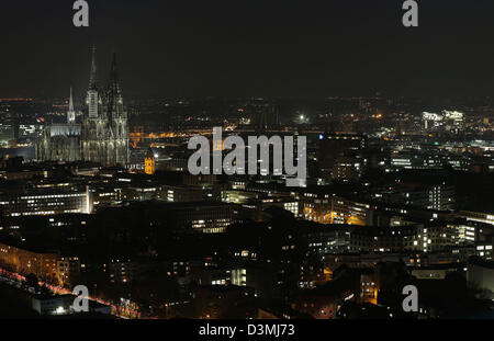 A view of the illuminated city centre at night and Cologne Cathedral (L) in Cologne, Germany, 18 February 2013. Photo: Oliver Berg/dpa Stock Photo