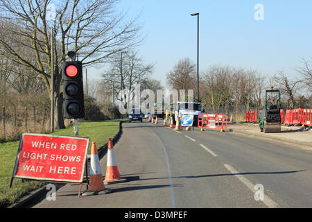 Red temporary traffic lights at road works Stock Photo - Alamy