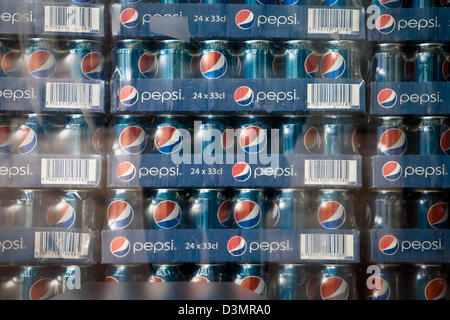 Stacks of Pepsi Cans in shop window Stock Photo