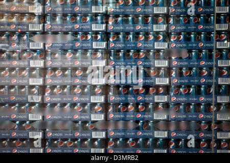 Stacks of Pepsi Cans in shop window Stock Photo