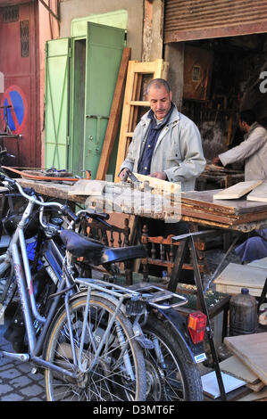 Carpenter working in a street of the medina or souk in Marrakesh, Morocco Stock Photo